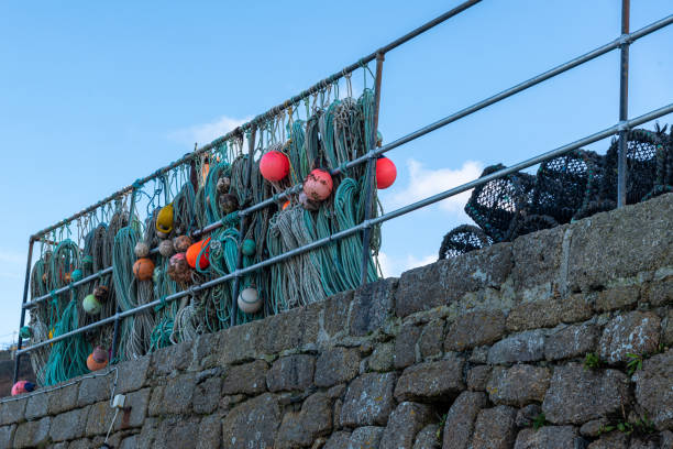 Coils of fishing ropes and nets drying on a pier in Qaqortoq, Greenland