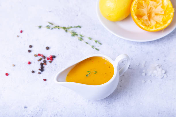istock Orange sauce to duck (bird) in a white saucer. 1186529992