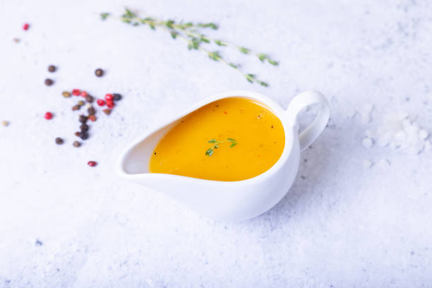 istock Orange sauce to duck (bird) in a white saucer. 1186530008