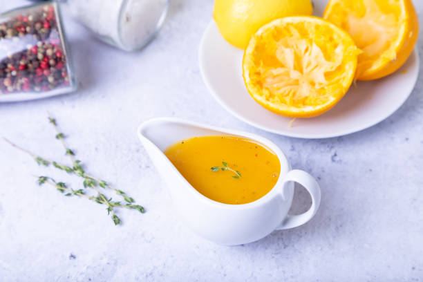istock Orange sauce to duck (bird) in a white saucer. 1186530036