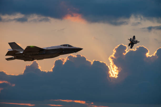 istock Stealth multirole combat aircraft in flight at sunset 1186531116