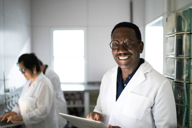 istock Portrait of a man working in a laboratory, using digital tablet 1186531197
