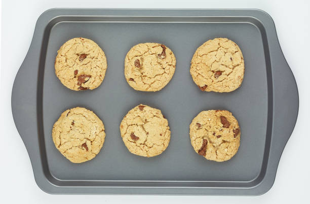 istock baking tray with homemade peanut cookies on white background, top view 1186532163