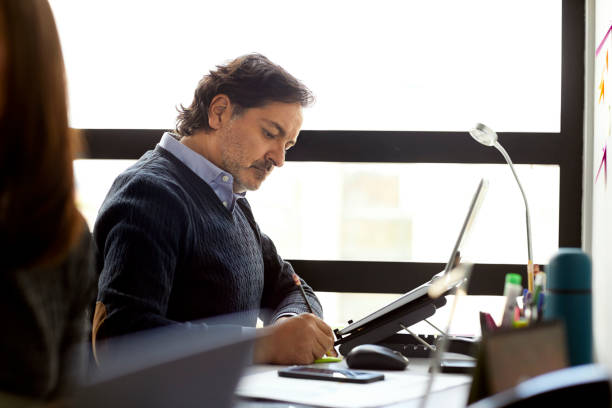 istock Businessman working at desk in coworking office 1186532953