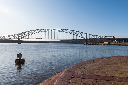 A truck crosses the Mississippi River on the Julien Dubuque Bridge, a trussed arch bridge built in the early 1940s, connecting East Dubuque, Illinois, and Dubuque, Iowa. (November 5, 2019)