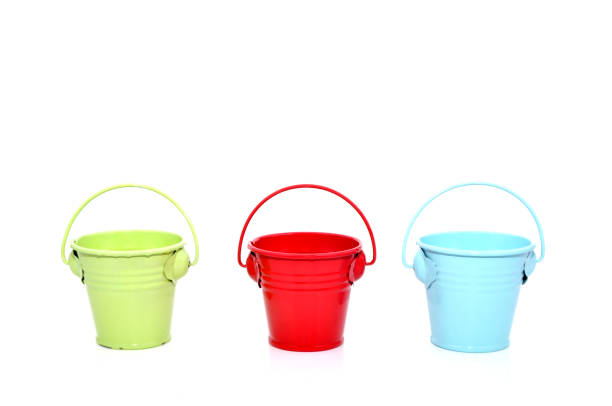 istock Three metal buckets of different colours with handle 1186541322