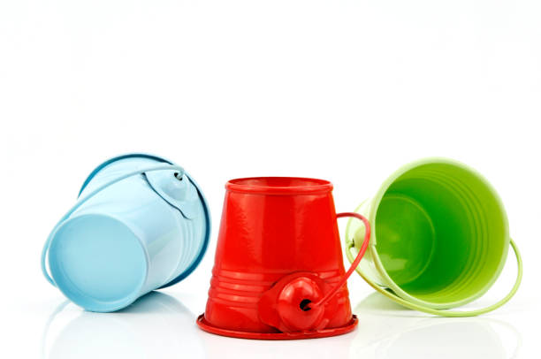 istock Three metal buckets of different colours with handle 1186541334