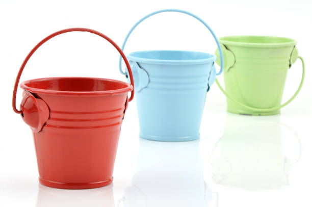 istock Three metal buckets of different colours with handle 1186541355