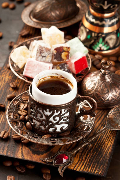 istock Dark  background  with Turkish coffee cups, aroma beans and easter sweets 1186541358