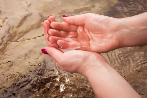 istock Hands dipped in the river. Wet hands. 1186541431