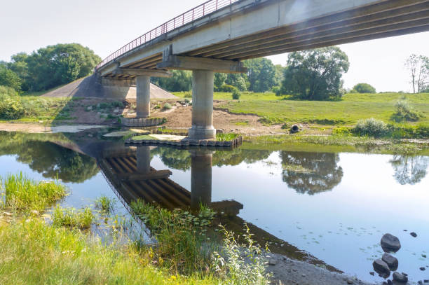istock a road bridge over a small river, river bridge 1186542198