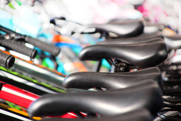 Three black bicycle seats for sale at a Phnom Penh store, Cambodia