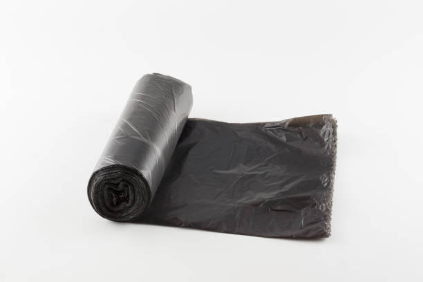 istock roll of trash bags isolated on white background 1186545383