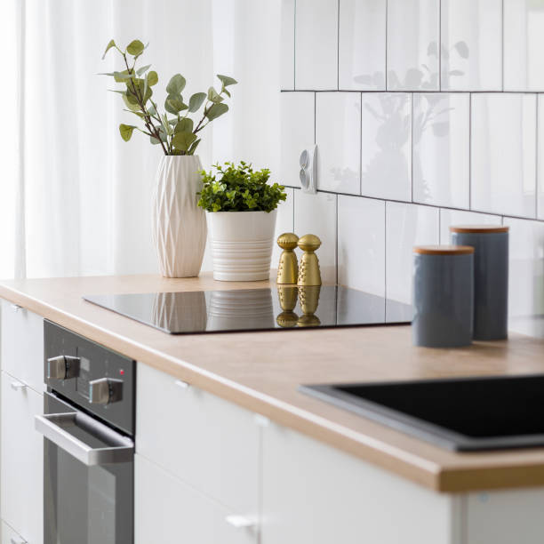istock White kitchen with wooden countertop 1186545517