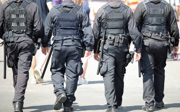 istock four cops patrolling the street 1186546601