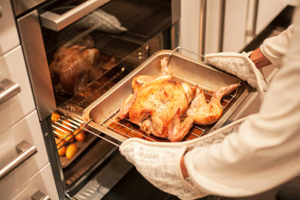 istock Cooking roast chicken in an oven 1186546674