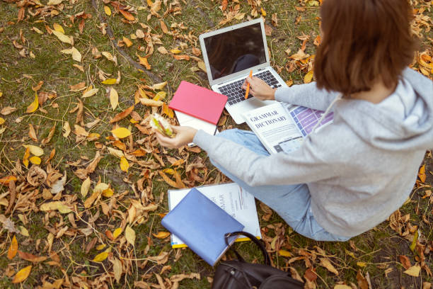 istock Busy brunette female working at her laptop 1186547216