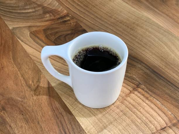 istock Americano coffee in a white cup on a wooden table 1186547832
