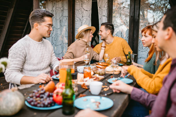 istock thanksgiving day celebration with friends 1186548087