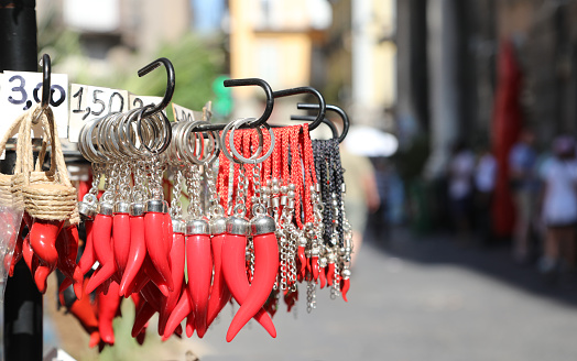many red cornet as amulets for sale at SpaccaNapoli street in the Naples City in Italy