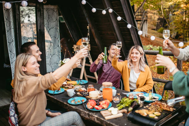 istock Dinner party at forest house 1186553124
