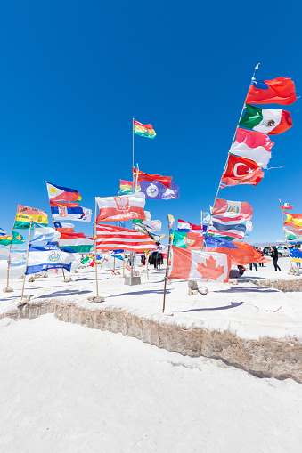 Uyuni Bolivia October 22  International flags in front of the sole hotel of Salar de Uyuni one of the stops during the tour.  Shoot on October 22, 2019