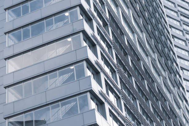 istock A part of abstract modern office building, skyscraper close up background 1186556218