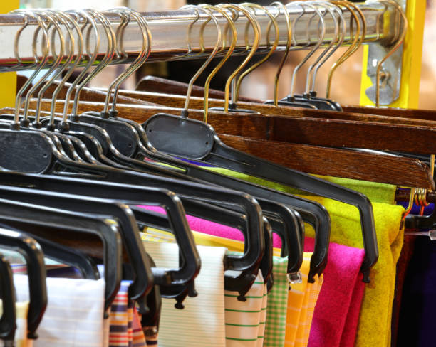 istock many hanging clothes for sale 1186561862