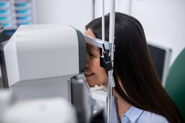 istock Patient smiling while visiting eye doctor and having eyesight examination 1186562801