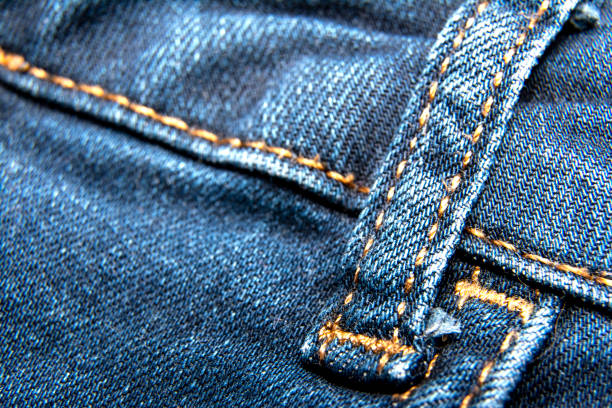 istock Blue jeans fabric textile material texture / macro denim background 1186562844