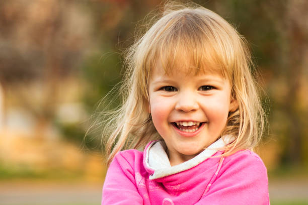 happy laughing cute little girl portrait - one baby girl only fotos imagens e fotografias de stock