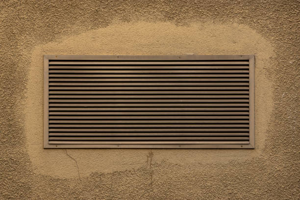 istock Ventilation grille installed later in wall, plaster repaired and repainted 1186564394