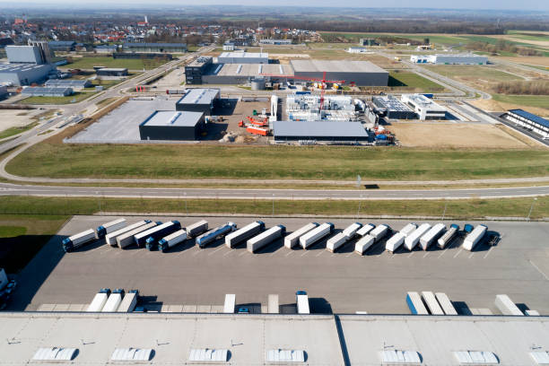 istock Aerial View of Trucks Loading at Logistic Center, Distribution Warehouse 1186570730