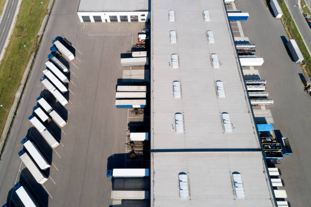 istock Aerial View of Trucks Loading at Logistic Center, Distribution Warehouse 1186570797