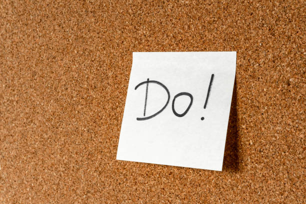 istock Believe yourself. Handwritten inspirational supportive lettering on a sticker on a cork board. Background and texture. 1186574076