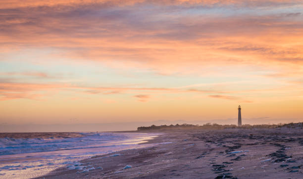 istock Cape May NJ lighthouse and Atlantic Ocean at sunset in springtime 1186575523