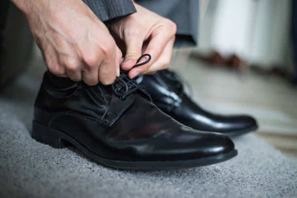 istock Businessman tying his shoes 1186575660