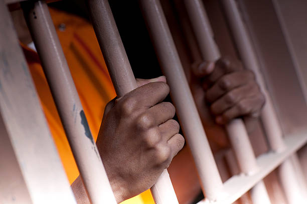 Prison Hands 2  prisoner stock pictures, royalty-free photos & images