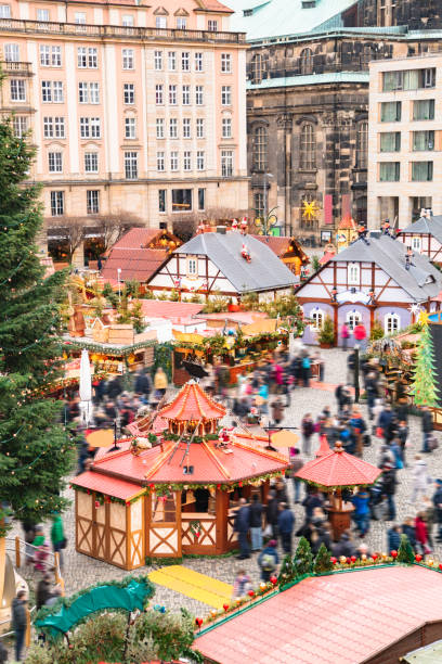 istock Christmas market with different stalls and tree 1186577677