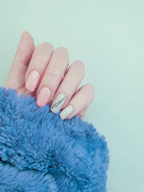 istock female hand beautiful manicure fur 1186578745