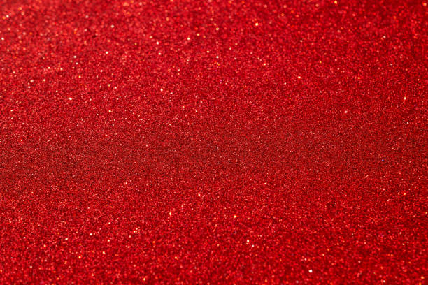 istock Festive abstract red glitter texture background. Colorful background with glittering and sparkling spots. Suitable for christmas, new year, chinese new year and designs. Selective focus 1186578886