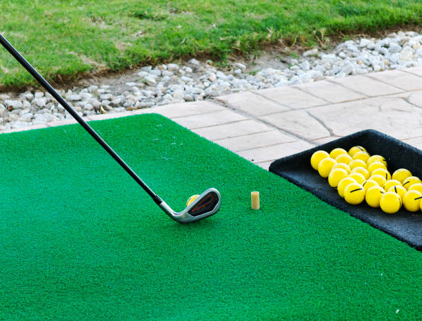 istock Golf training balls and golf club on green grass. 1186579705