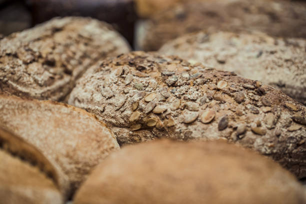 istock Fresh bread on the counter in the store, close-up . 1186581174