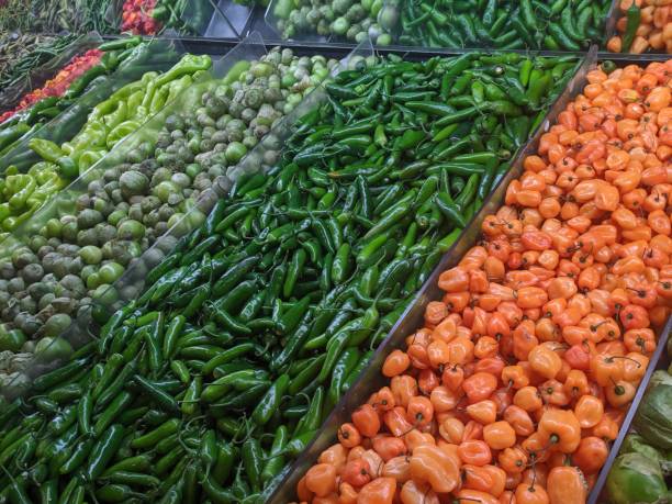 istock Various Spicy Peppers for sale at a Grocery Store 1186582108