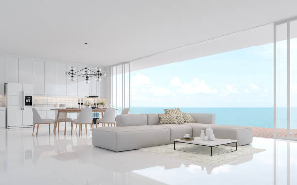 istock Luxury white living dining room with sea view 3d render 1186586716