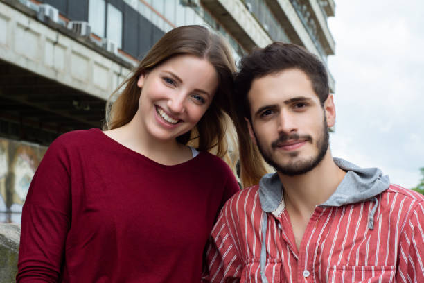 istock Two University students studying together outdoors 1186588306