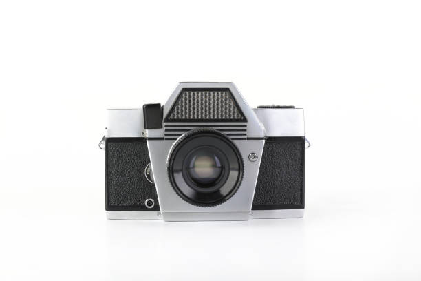 istock The old 35 mm film camera with lens, on white background. 1186589664