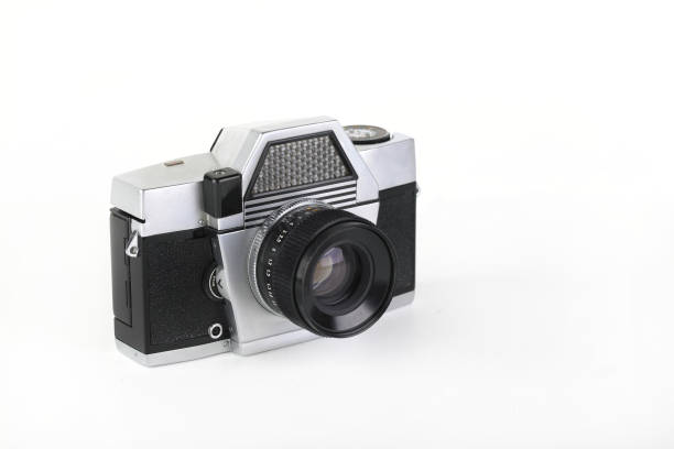 istock The old 35 mm film camera with lens, on white background. 1186589667