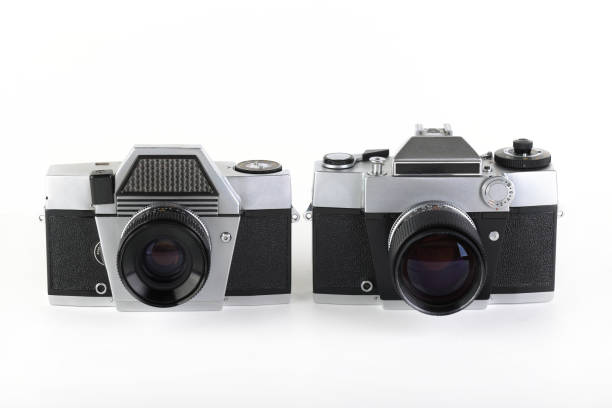 istock The old 35 mm film camera with lens, on white background. 1186589671