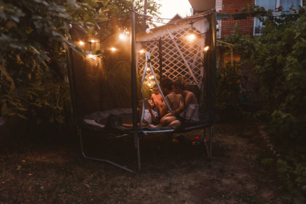 istock Happy family on a trampoline 1186594535